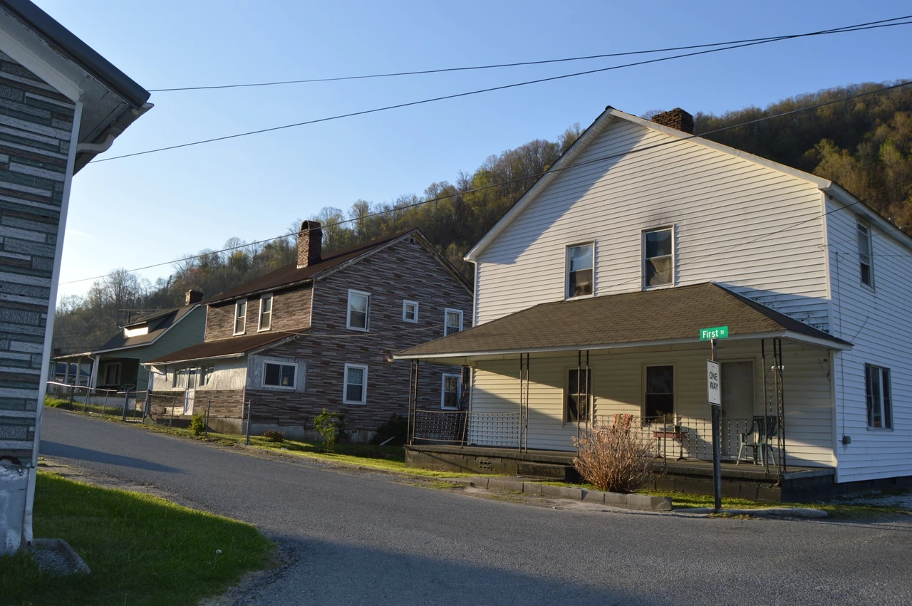 Houses with front porches along First Street at Pirate Way in Lynch, Kentucky.